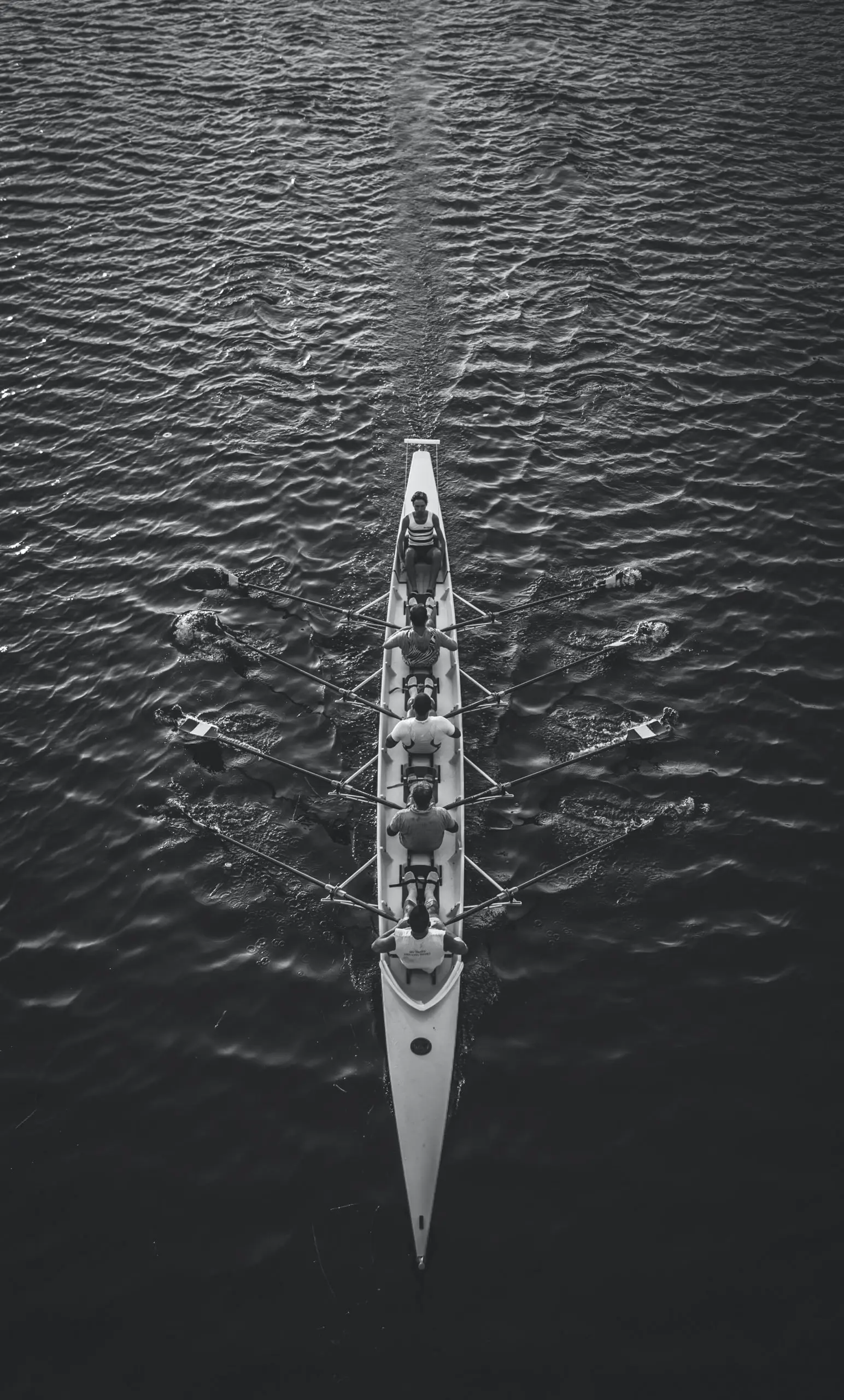people riding boat on body of water